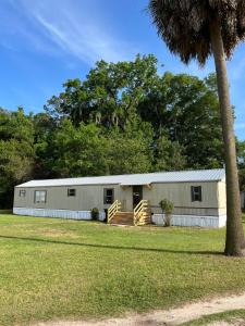 a large white building with a porch at Hogarth in Beaufort