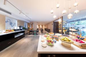 a kitchen with a table with fruits and vegetables on it at Atour X Hotel Shenzhen Longhua Dalang Commercial Center in Bao'an