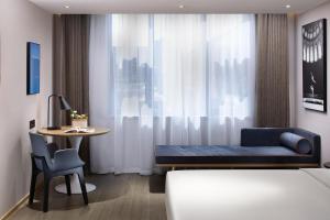 Postel nebo postele na pokoji v ubytování Atour Hotel Changsha Wangcheng District