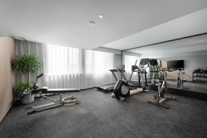 a gym with cardio equipment in a large room at Atour Hotel Xian Chanba International Convention Exhibition Center in Xi'an