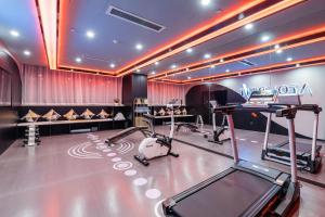 a gym with several exercise equipment in a room at Atour Hotel Nanjing Olympic Sports Center Tianhe Plaza in Nanjing