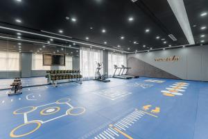a room with a gym with a blue floor at Atour Hotel Shangxing Lu Xun s Hometown in Shaoxing