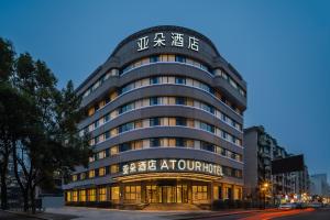 a building with a sign on the front of it at Atour Hotel Hangzhou West Lake Hubin North Zhongshan Road in Hangzhou