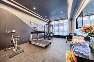 a gym with a treadmill and a exercise bike at Atour Hotel Huzhou Nanxun Ancient Town in Huzhou