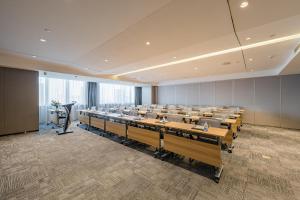 a large room with rows of desks in it at Atour Hotel Hefei USTC Huangshan Road in Hefei