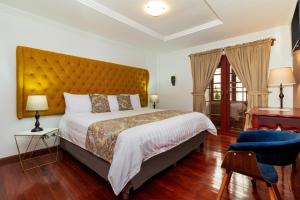 Postel nebo postele na pokoji v ubytování Hotel Posada del Rey