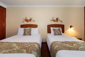 Postel nebo postele na pokoji v ubytování Hotel Posada del Rey