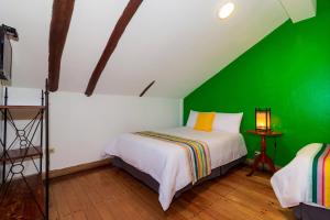 Postel nebo postele na pokoji v ubytování Hotel Posada del Rey