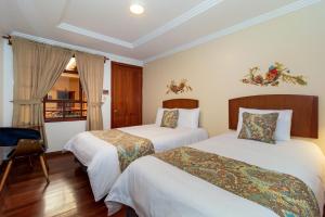Postel nebo postele na pokoji v ubytování Hotel Posada del Rey