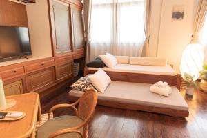 Телевизор и/или развлекательный центр в A Day Villa Chiangmai