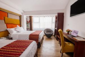 Postel nebo postele na pokoji v ubytování Hotel Hacienda Cusco Centro Historico