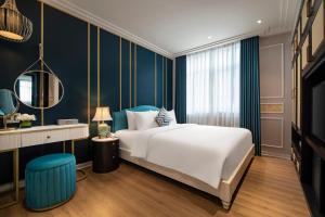 Postel nebo postele na pokoji v ubytování Angel Hotels Beach Danang