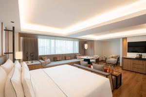 清迈美利亚酒店 (Melia Chiang Mai)的电视和/或娱乐中心