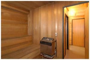 a empty room with a sauna in a house at Dakune Lodge in Ohakune