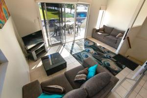 an aerial view of a living room with a couch at Tasman Beachside Apartment in Port Lincoln