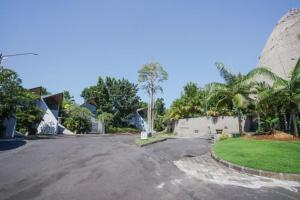 an empty street in a house with trees at Villa Bima II in Nusa Dua