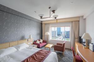 Postel nebo postele na pokoji v ubytování Hotel Okura Niigata