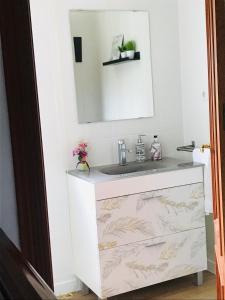 a bathroom vanity with a sink and a mirror at AT VISTA GRANADA in Monachil