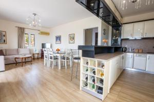 a kitchen and living room with a couch and a table at Karpathos View Villa in Karpathos