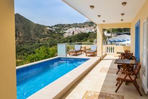 a villa with a swimming pool with a view at Karpathos View Villa in Karpathos Town