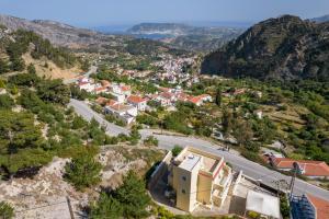 an aerial view of a town in the mountains at Karpathos View Villa in Karpathos
