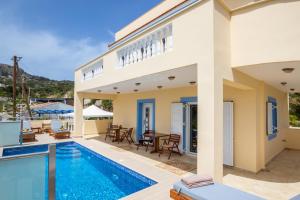 a villa with a swimming pool and a house at Karpathos View Villa in Karpathos