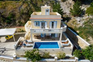 an aerial view of a house with a swimming pool at Karpathos View Villa in Karpathos