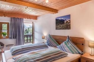 Postel nebo postele na pokoji v ubytování Haus Niklos - Wank