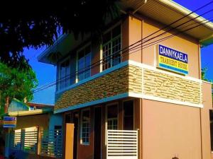 a building with a sign on the side of it at Dannykaela Transient House in Vigan