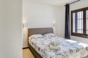 A bed or beds in a room at Villa Tordera