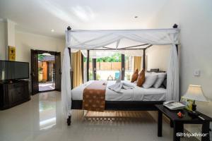 Postel nebo postele na pokoji v ubytování Bali Ayu Hotel & Villas + 37 fotografií