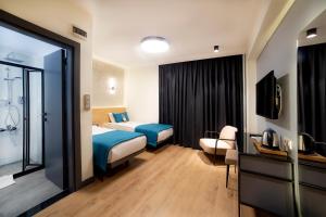 Postel nebo postele na pokoji v ubytování Barin Hotel