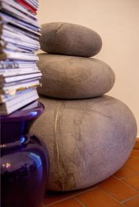 a stack of rocks sitting on top of a floor at B&B La Locandiera in Castiglione della Pescaia