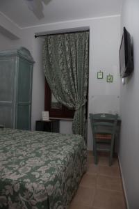 Giường trong phòng chung tại Hotel Il Tiglio