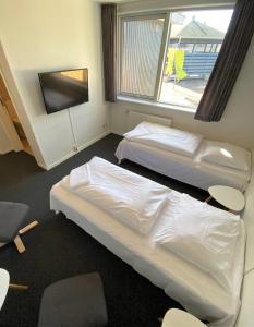 Katil atau katil-katil dalam bilik di Motel Skive
