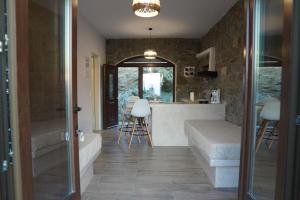 a bathroom with a tub and a sink and a counter at Casa Borealis in Naxos Chora