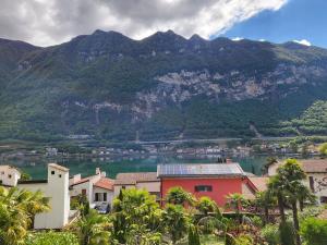 a view of a town with a lake and mountains at Al Ronchetto in Riva San Vitale