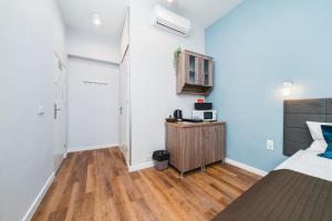 Postel nebo postele na pokoji v ubytování Grace Apartments