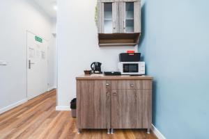 Kuchyň nebo kuchyňský kout v ubytování Grace Apartments