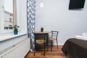 Postel nebo postele na pokoji v ubytování Grace Apartments