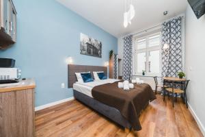 Postel nebo postele na pokoji v ubytování Grace Apartments