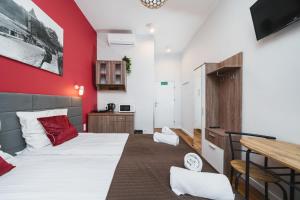 Postel nebo postele na pokoji v ubytování Grace Apartments