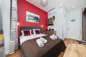 Postel nebo postele na pokoji v ubytování Grace Apartments
