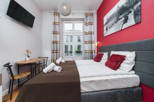Postel nebo postele na pokoji v ubytování Grace Apartments