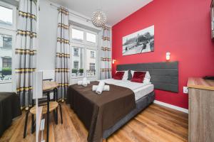 Postel nebo postele na pokoji v ubytování Grace Apartments