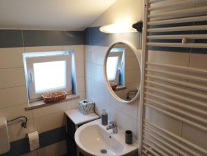 a bathroom with a sink and a mirror at Apartment SENA in Vodnjan +9 photos