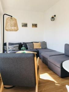 Posezení v ubytování Appartement C 2 chambres très lumineux