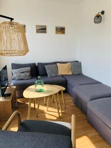Posezení v ubytování Appartement C 2 chambres très lumineux