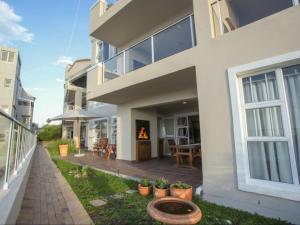an exterior view of a house with a patio at Go2Boa Luxury Apartment in Mossel Bay