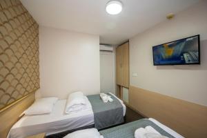Postel nebo postele na pokoji v ubytování Hotel Melita